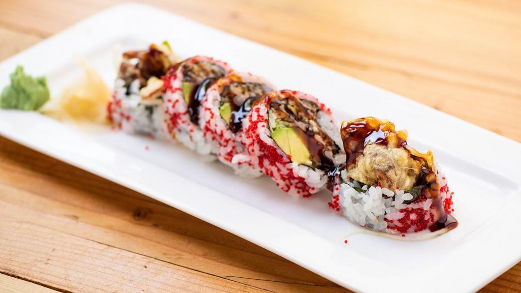 Spider Roll · Softshell crab, avocado, and cucumber inside, caviar on top with eel sauce.