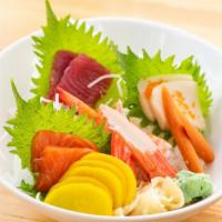 Chirashi · 17 pcs assorted raw fish over rice. Served with side.