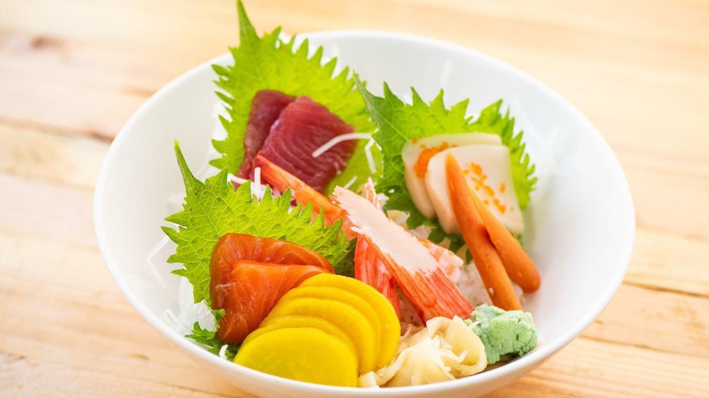 Chirashi · 17 pcs assorted raw fish over rice. Served with side.