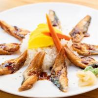 Unagi Don · 10 pcs broiled eel over rice. Served with side.