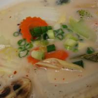 Tom Kha Gai · Hot. Chicken in coconut milk soup with galangal, lime juice, mushrooms, bell peppers, onions...