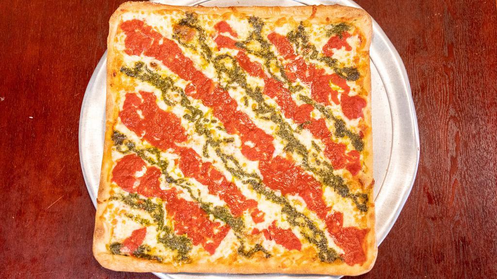 Grandpa Pizza · Thin crust Sicilian topped with our signature tomato sauce, sliced mozzarella, and our homemade pesto sauce.