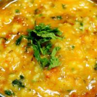 Yellow Dal · Traditional Yellow lentils slow-cooked in a tadka style.
