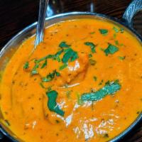 Butter Chicken · Dark meat chicken cooked in creamy, widely acclaimed signature sauce.