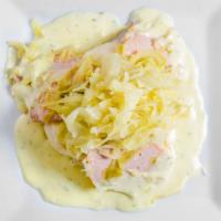 Bacon & Cabbage · Boiled bacon with cabbage over mashed potato served with parsley sauce.