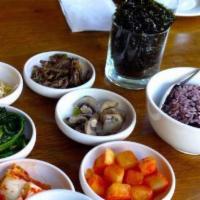 Rice & Banchan / 반찬 · Assortment of traditional Korean sides made in house at our kimchee market served with Dokeb...
