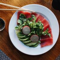 Tuna Sashimi & Avocado Salad · Sliced sushi-grade tuna, avocado, and watercress.
