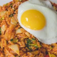 Kimchee Bokkeum Bap / 김치볶음밥 · Stir-fried rice with fermented cabbage kimchee and mixed vegetables. 

Note: Our kimchee is ...