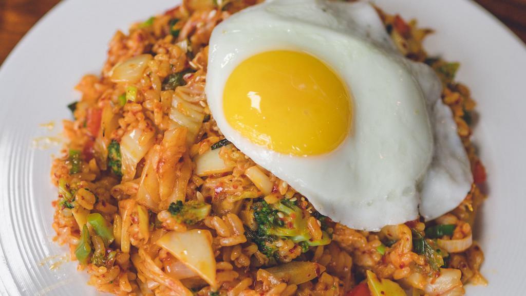Kimchee Bokkeum Bap / 김치볶음밥 · Stir-fried rice with fermented cabbage kimchee and mixed vegetables. 

Note: Our kimchee is fermented using seafood ingredients