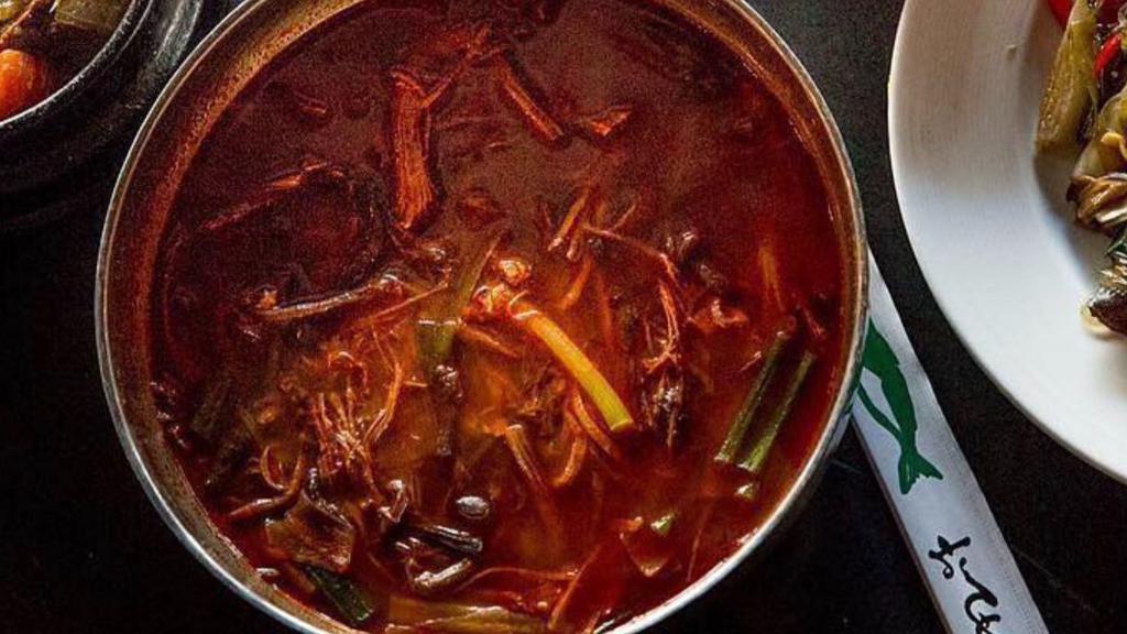 Yookgaejang / 육개장 · Spicy soup with shredded beef brisket, green onion, egg, Korean fernbrake, and cellophane noodles. Served with a side of Dokebi rice.