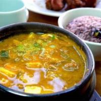 Denjang Chigae / 된장찌개 · Spicy and pungent bean-paste stew with beef, tofu, potato, zucchini, onion, and hot Korean p...