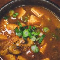 Vegan Denjang Chigae / 된장찌개 · Spicy and pungent bean-paste stew with tofu, potato, zucchini, onion, and hot Korean peppers...