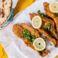 Fried Fish (Lb.) · Fresh fish marinated and fried in a combination of spices.