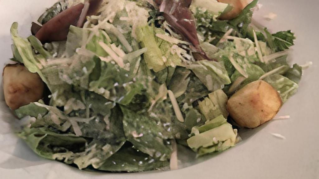 Large Caesar Salad · Romaine hearts topped with croutons, Parmesan cheese and Caesar dressing.