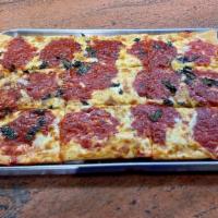 Grandma Slice Pizza · Thin square crust, grated Parmesan, with fresh garlic and basil, topped with our homemade to...