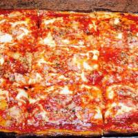 Upside-Down Sicilian Slice Pizza · Deep dish, square crust, imported finest grande mozzarella, romano, oregano and marinara sau...