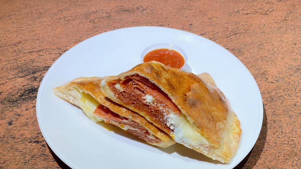 Pepperoni Calzone · Made with 3 cheeses ricotta, Romano and mozzarella. Served with marinara sauce on the side.
