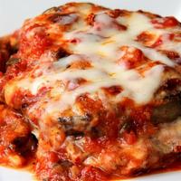 Eggplant Parmigiana Dinner · Eggplant cutlet with fresh tomato sauce topped with melted mozzarella.