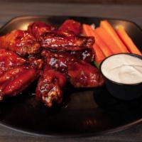 Wings · Served with a side of chunky bleu cheese or house-made buttermilk ranch dressing and celery ...