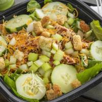 Buffalo Chicken Salad · Spicy fried buttermilk chicken, house battered, cucumbers, chopped celery, topped with shred...