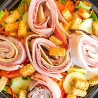 Chef Salad · Sliced turkey, ham and roast beef. Rolled with swiss cheese, tomatoes, cucumbers, carrots, h...