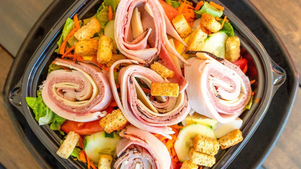 Chef Salad · Sliced turkey, ham and roast beef. Rolled with swiss cheese, tomatoes, cucumbers, carrots, hard boiled egg and croutons.
