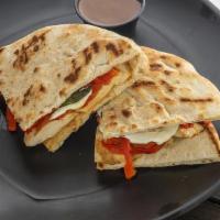 Mozzarella Red Panini · Grilled chicken breast, roasted red peppers, melted fresh mozzarella and fresh basil. Served...