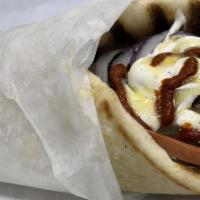 Chicken Gyro · Freshly cooked chicken Gyro served with Pita, lettuce, tomatoes, white sauce and hot sauce.
