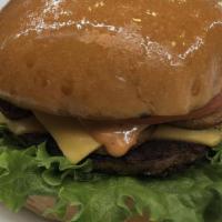 Classic Burger · 2(4 ounces) smashed burger with 2 slices of American cheese, lettuce, tomato, and famous sau...