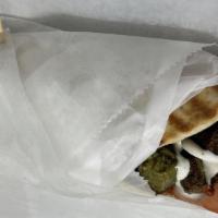 Falafel Gyro · Freshly cooked Falafel Gyro served with Pita, lettuce, tomatoes, white sauce and hot sauce.