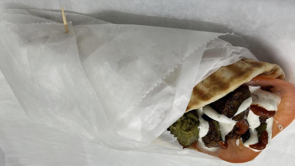 Falafel Gyro · Freshly cooked Falafel Gyro served with Pita, lettuce, tomatoes, white sauce and hot sauce.