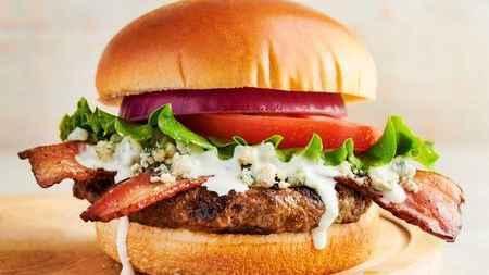 Bleu Cheese Bacon Burger · 1/2 pound burger, blue cheese crumbles, bacon, lettuce, tomato and special sauce on a brioche bun.