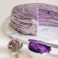 Purple Yam Mille Crepe Cake · A slice of perfectly layered crepes with purple yam pastry cream.
