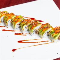 Dragon Roll · Eel and cucumber inside with avocado, red tobiko and eel sauce on top.