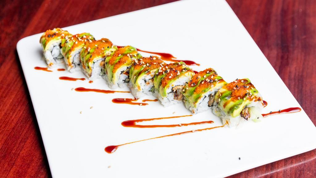 Dragon Roll · Eel and cucumber inside with avocado, red tobiko and eel sauce on top.