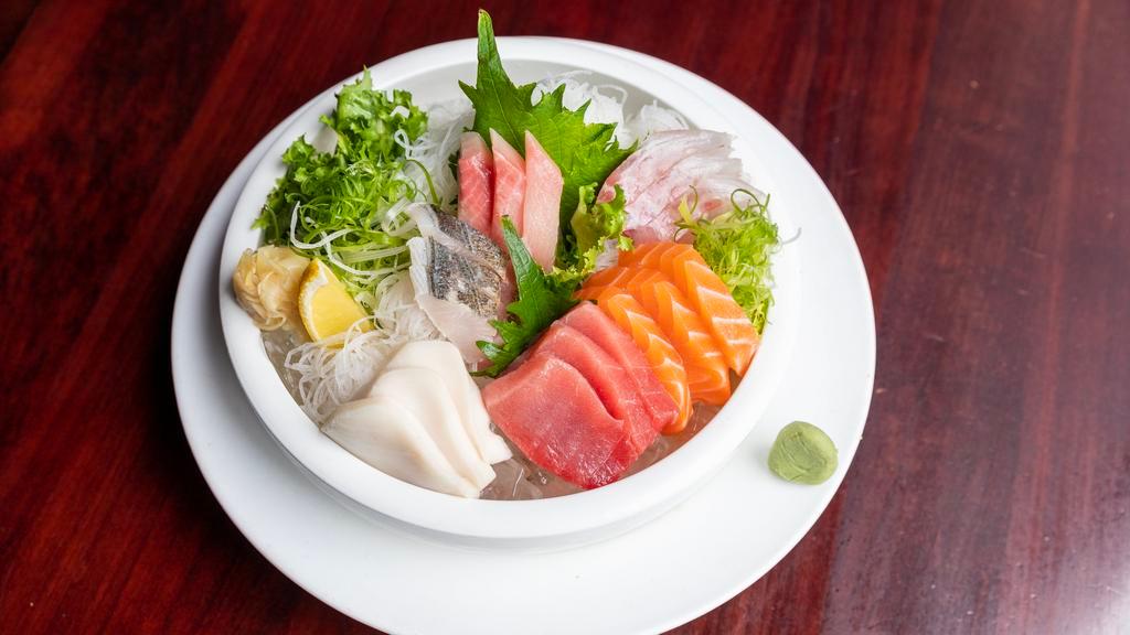 Sashimi Deluxe · 18 pieces sashimi. Served with miso soup or garden salad.