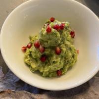 Guacamole · Fresh avocado smashed with lime juice, cilantro-onions and jalapenos. Served with crispy Tla...