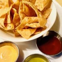 Chips And 3 Salsas · Crispy corn chips served with three different salsas 2oz each. Chipotle, salsa verde and chi...