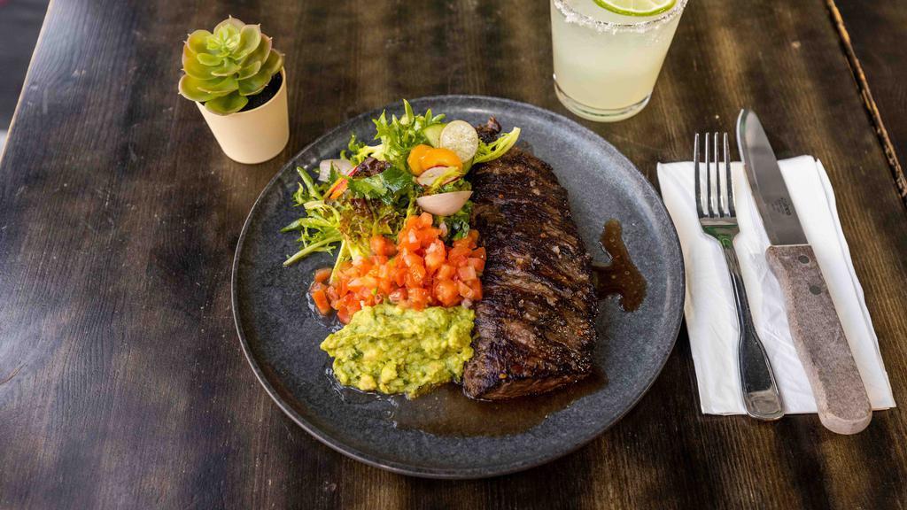 Carne Asada · (Pat La Frieda) Grassfed Skirt Steak Served with green salad, salsa and guacamole.