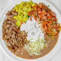Carnitas Burrito Bowl · Mexican rice or lettuce, beans, muenster cheese, sour cream, pico de gallo, and corn.