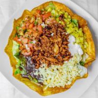 Pastor Taco Salad · Served with lettuce, muenster cheese, sour cream, corn, black or pinto beans, and pico de ga...
