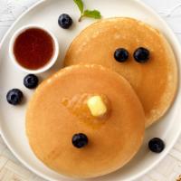 Feeling Blueberry Pancakes · Fluffy pancakes cooked with care and love served with blueberries, butter and maple syrup. S...