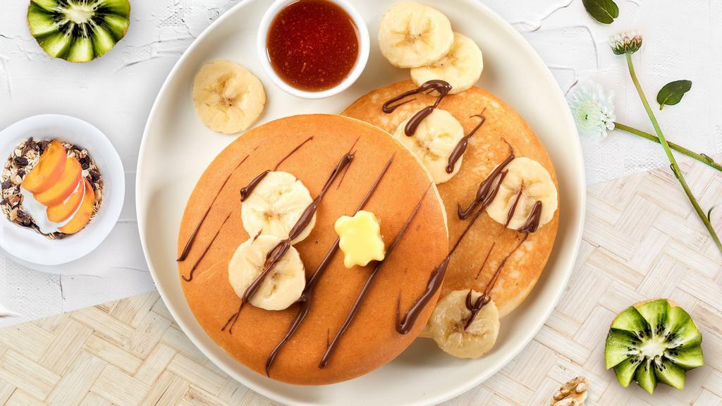 Wanna Banana Pancakes · Fluffy banana pancakes cooked with care and love served with butter and maple syrup. Served in pairs.