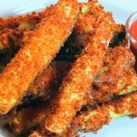 Fried Zucchini · Battered and breaded fresh zucchini fried in virgin olive oil.
