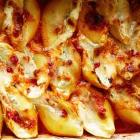 Baked Stuffed Shells · Stuffed with ricotta cheese and smothered in San Marzano tomato sauce.
