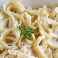 Fettuccine Alfredo · Homemade white cream sauce with sweet butter, fresh egg yolks and imported Parmesan cheese.