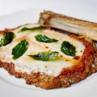 Veal Parmigiana · Natural veal cutlet with San Marzano sauce covered with mozzarella cheese. Served with choic...
