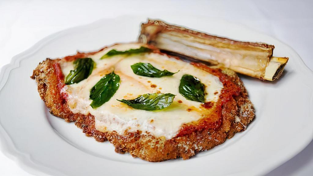 Veal Parmigiana · Natural veal cutlet with San Marzano sauce covered with mozzarella cheese. Served with choice of side.