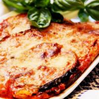 Eggplant Parmigiana · Served with pasta or salad, choice of cheese or no cheese