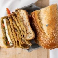 Leo'S Calabrese Sandwich · Chicken or eggplant cutlet, fresh mozzarella balsamic, pesto, roasted red peppers.